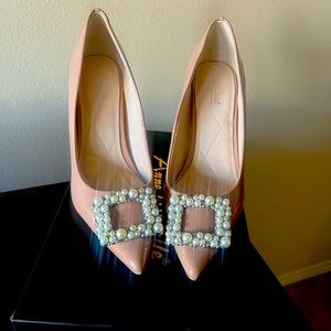 Nude patent embellished pumps